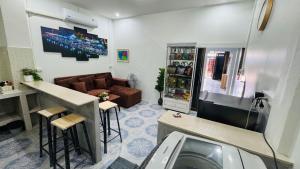 a living room with a tv and a couch at BS myhome in Sathani Hat Yai