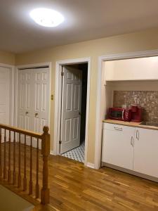 a kitchen with a sink and a microwave at Downtown Halifax suites in Halifax