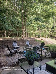 a group of chairs and tables in a yard at Southern Charmer in Stone Mountain