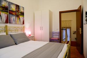 Ένα ή περισσότερα κρεβάτια σε δωμάτιο στο Casa Bianca