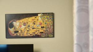a picture of a painting on a wall at Al ladito de Sevilla in Bormujos