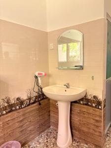 a bathroom with a sink and a mirror at Mountain Shack Homestay in Ella +41 photos