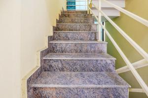 a set of stairs in a house at Hotel O Together in Bangalore