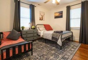a bedroom with two beds and a window at Sweet Home in Greenville