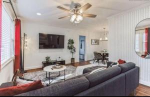 a living room with a couch and a ceiling fan at Sweet Home in Greenville