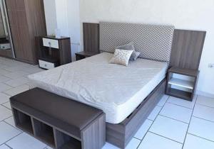 a bedroom with a large bed with two night stands at Chez alpha in Casablanca