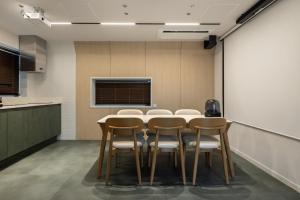 a conference room with a table and chairs at Daejeon Anook Hotel Yuseong Oncheon Station in Daejeon +148 photos
