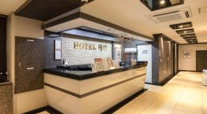 a restaurant with a counter in a room at Osan J Hotel in Osan +86 photos