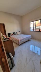 a bedroom with a bed in the corner of a room at Milla villa in Alligator Pond Village