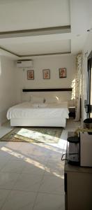 a bedroom with two beds in a room at Villa Nostra in Ngaparou