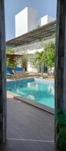 a swimming pool in the middle of a building at Villa Nostra in Ngaparou