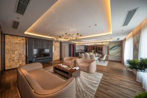 a large living room with couches and a television at Anyla Sầm Sơn Hotels in Sầm Sơn