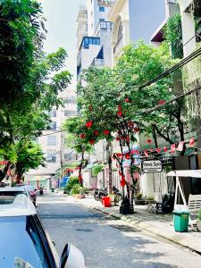 a street with a car parked on the side of the road at Da Nang Sleepbox & Dorm in Danang