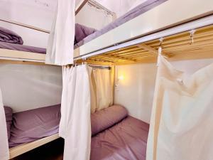 a couple of bunk beds in a room at Da Nang Sleepbox & Dorm in Danang