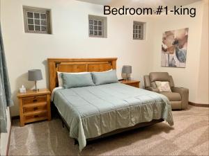 a bedroom with a bed and a chair and a bed petertodd at Spacious Home in Page