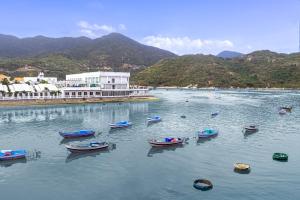 a group of boats in a body of water at O'Stay Vinh Hy in Vĩnh Hy +38 photos