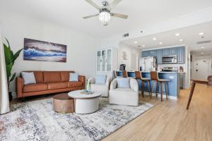 a living room with a couch and a table at Splash Resort, 16th floor, Oceanfront, 1BR Sleeps 6, Lazy River & Water Park in Panama City Beach