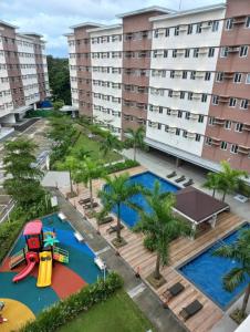 an aerial view of a water park with a playground at Condotel in SM Trece Martires in Trece Martires
