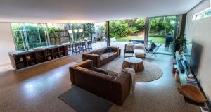 a living room with two couches and a table at Dune Ten in Fingal Head +14 photos