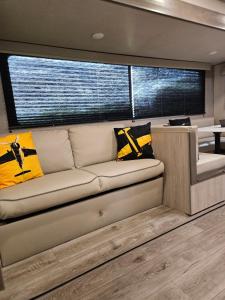 a living room with a couch in a boat at Pilot Glamp in Vieques