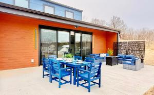 a blue table with blue chairs on a patio at The Sandpearl in Stevensville