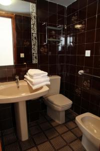 a bathroom with a sink and a toilet and a mirror at Maresto Calle Mar in Salou