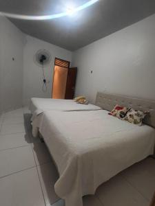 a bedroom with a large bed in a room at Eds pousada II in Juazeiro do Norte +15 photos