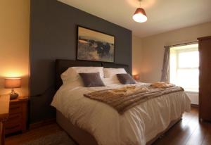 En eller flere senge i et værelse på Gwarcwm Uchaf