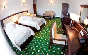 Postel nebo postele na pokoji v ubytování Hotel SPA Faltom Gdynia Rumia