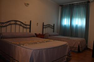 Katil atau katil-katil dalam bilik di Hostal Tamarindos
