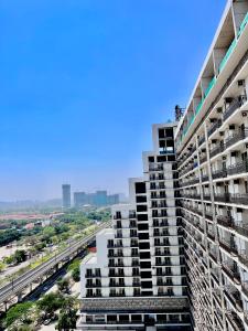 a view of a tall apartment building at Stayverse noida in Greater Noida