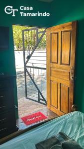 an open door to a room with a gate at Casa Tamarindo in Las Peñitas