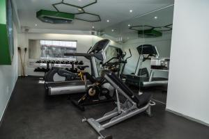 a gym with two exercise bikes in a room at Hotel Casa Ciudad in Mexico City