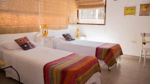 מיטה או מיטות בחדר ב-Cabañas Cultura Tafi