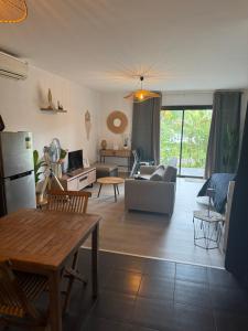 a living room with a couch and a table at Bora bora studio vacation in Bora Bora +9 photos