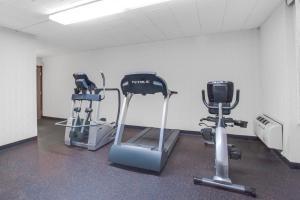 a gym with two exercise bikes in a room at Days Inn by Wyndham Liberty in Ferndale