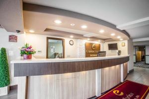 a lobby of a hospital with a reception counter at Clarion Inn Renton-Seattle in Renton
