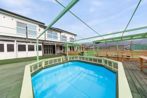 a large swimming pool on top of a building at Abientot Spa Pension Ganghwa in Incheon