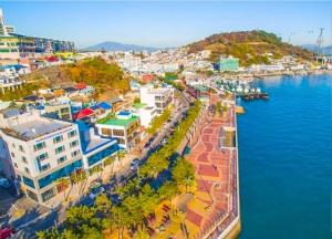 an aerial view of a city next to the water at Yeosu Sun Beach Pension in Yeosu