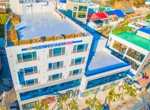 an aerial view of a resort with a swimming pool at Yeosu Sun Beach Pension in Yeosu