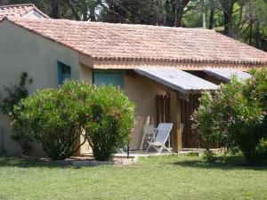 a small house with a chair in front of it at Residence Les Sellettes in Saint-Tropez