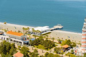 an aerial view of a beach with a lighthouse at Guest Favorite Sea View Apartments Batumi in Batumi