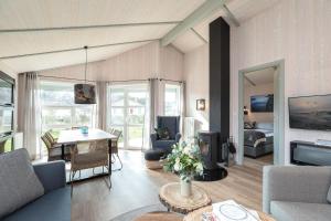 a living room with a couch and a table at Ferienhaus Strandpark 41 in Grömitz