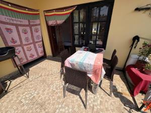 a room with a table and chairs in a room at Monkey Temple Homestay in Kathmandu