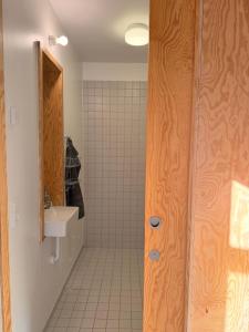 a bathroom with a shower and a sink at 44Møen in Askeby