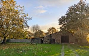 an old brick building in a field with trees at chambre chez hote familiale 2, 4, 5,6 in Mareuil-sur-Lay +7 photos