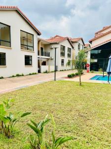a view of a house with a yard at SouthSide Apartment in Gaborone