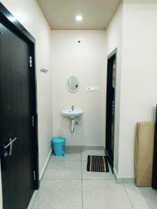 a bathroom with a sink and a toilet at Sri Datta Paduka Nivas in Pithāpuram