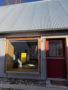 a yellow chair sitting inside of a building at 44Møen in Askeby