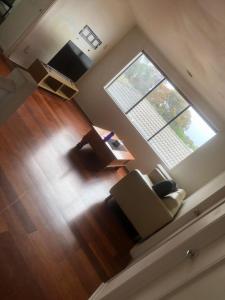 an overhead view of a living room with a couch and a window at Manors Bvld in Wyndham Vale